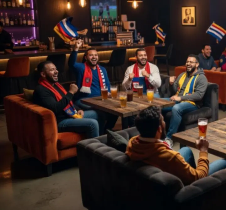Strefa kibica w barze FAUST ŁUKASZ MALINOWSKI z kibicami oglądającymi mecz.